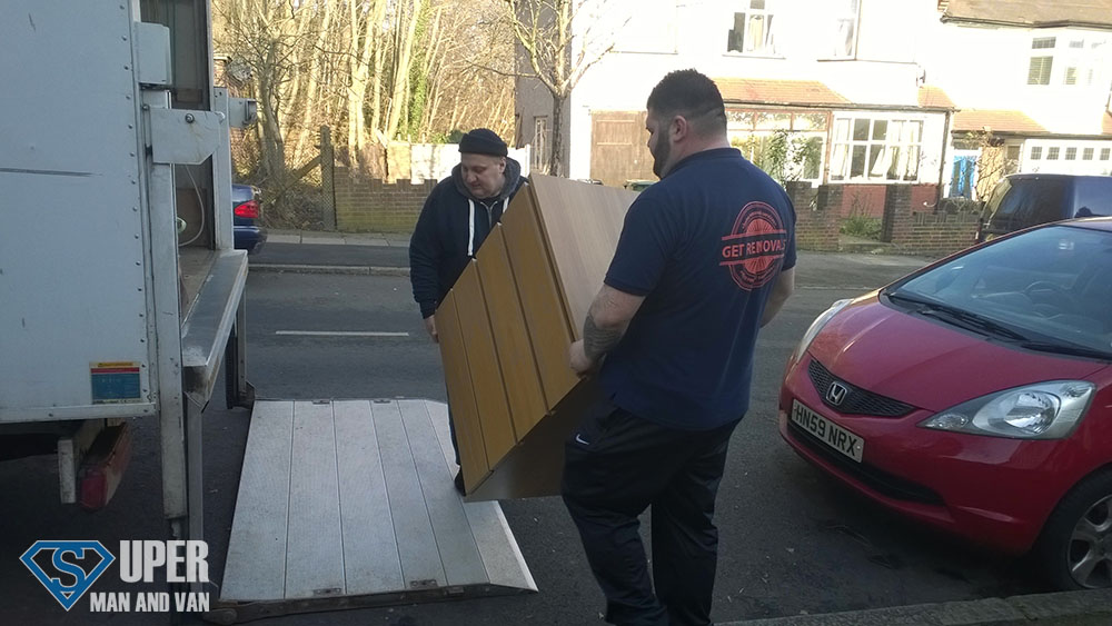 Men loading a piece of furniture